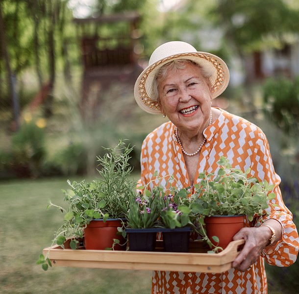 Woman harvesting herbs